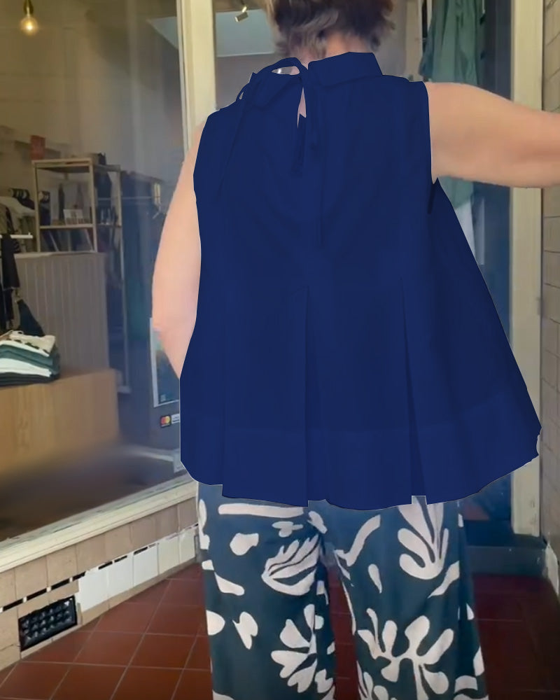 Sana – Blouse unie sans manches au style minimal chic