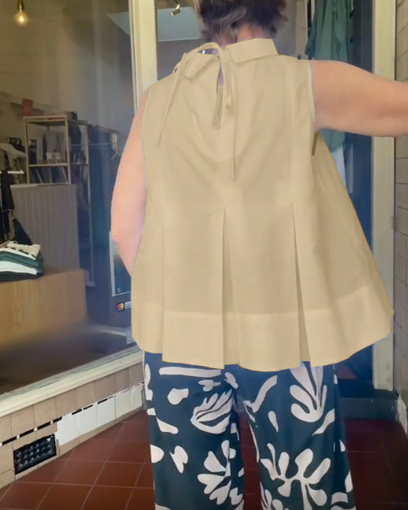 Sana – Blouse unie sans manches au style minimal chic